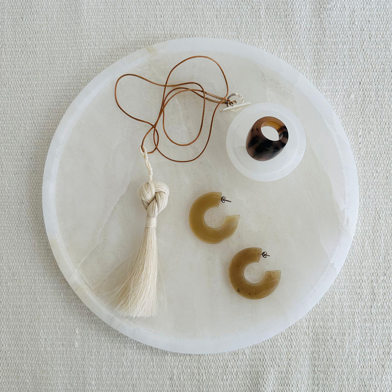 M+A NYC Alabaster Round Tray with Jewelry displayed on top