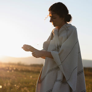 Photo of M+A NYC Handloomed Offset Stripe Cape worn by Kathi Hendrick. Photographer: Kate Warren