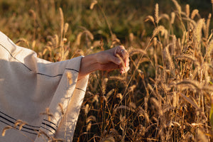 Photo of M+A NYC Handloomed Offset Stripe Cape worn by Kathi Hendrick. Photographer: Kate Warren