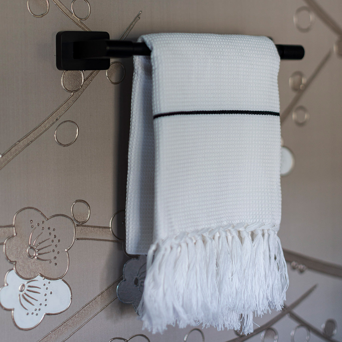 M+A NYC Honeycomb Towel Hanging on a towel rack in the Kingston  Design Showhouse 