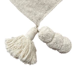 Detail of the Tassel and Pom Pom that are attached to the Hand Loomed Offset Stripe Coverlet