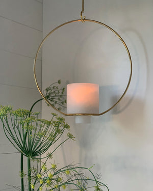 Image of M+A NYC Hanging Planter being used as a lantern and lit with a glass votive inside.