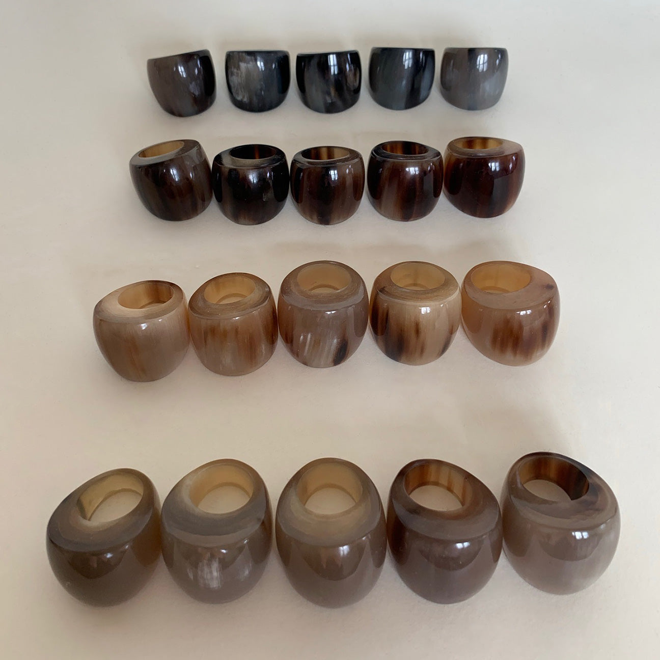 Lineup of M+A NYC Horn Cocktail Rings showing from top to bottom row: Smoke, Tortoise, Milk Caramel and Fawn