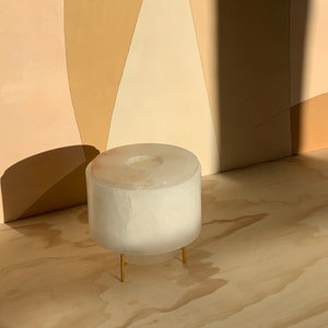 Image of M+A NYC Planter/Vase Set in alabaster glowing in the early evening light and sitting in front of wallpaper by Fromental Design.
