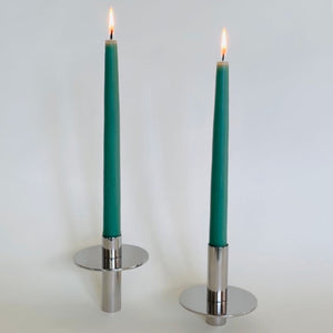 image of M+A NYC Pogo Candle Stands in Silver with lit green tapers