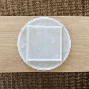 Image of M+A NYC Alabaster Trays nestled inside of each other.