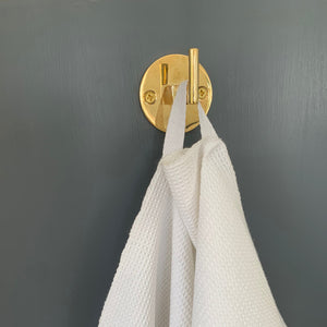 Closeup of loop detail on M+A NYC Hand Loomed Honeycomb Hand Towel hanging from their Solid Brass Wall Hook in the 1 3/4" length.